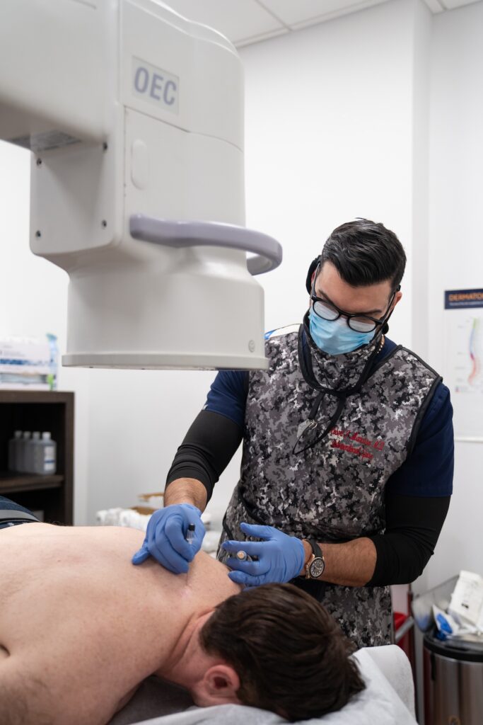 Robert F. Mancuso performing a spinal procedure